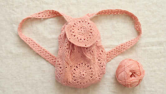 Wanderlust mini crochet backpack in pink, flat lay